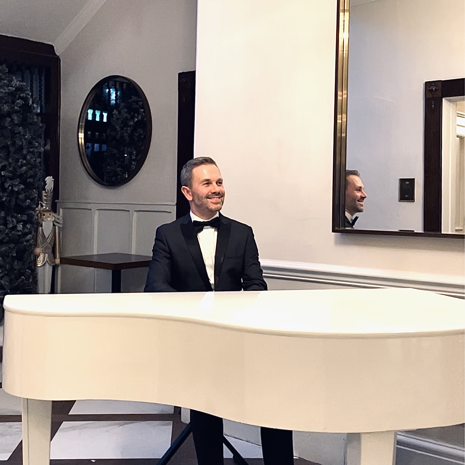 Bartle Hall pianist Craig Smith plays for a wedding reception in the house