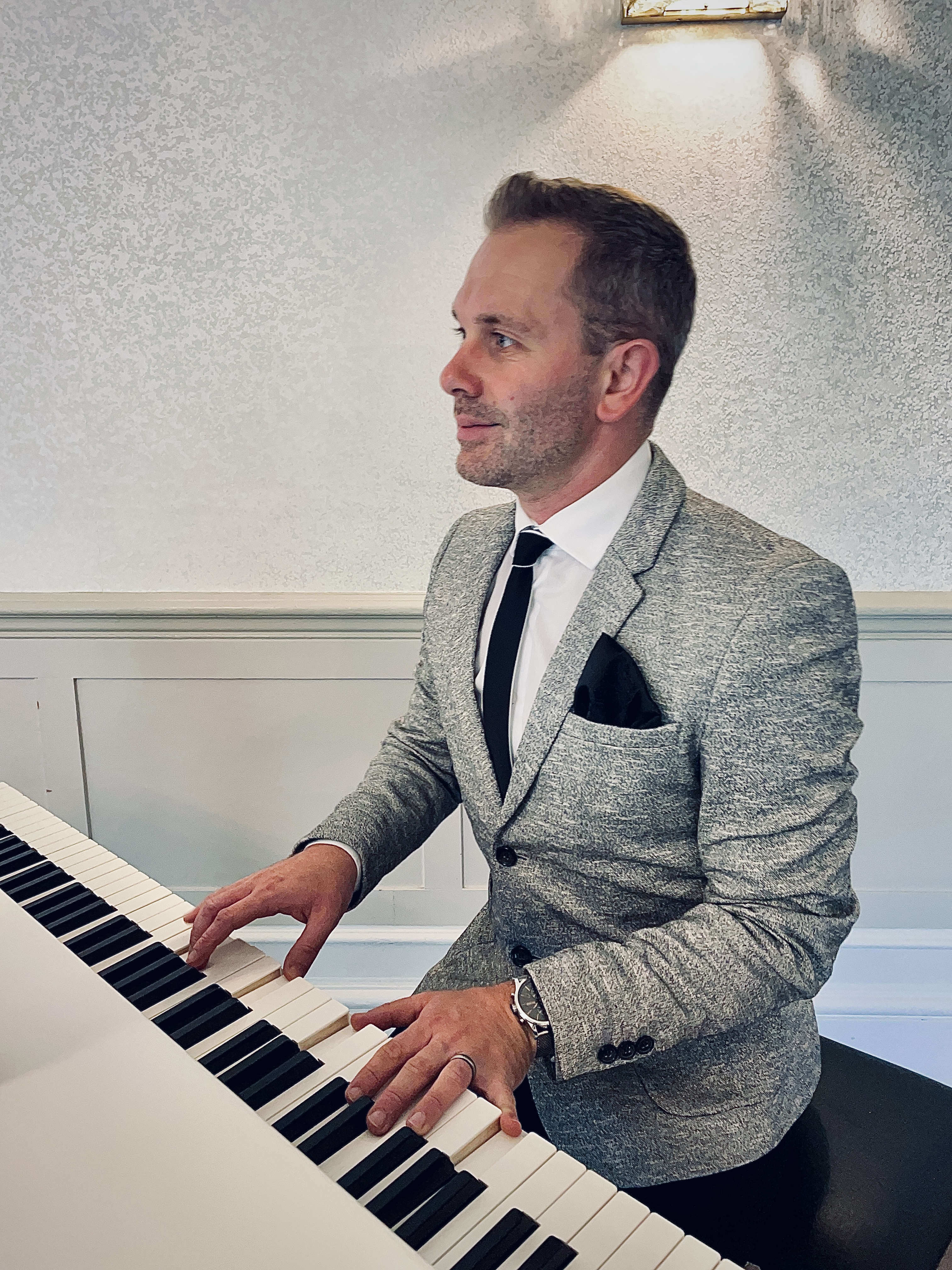 Bartle Hall wedding piano Craig Smith plays piano during a wedding ceremony.