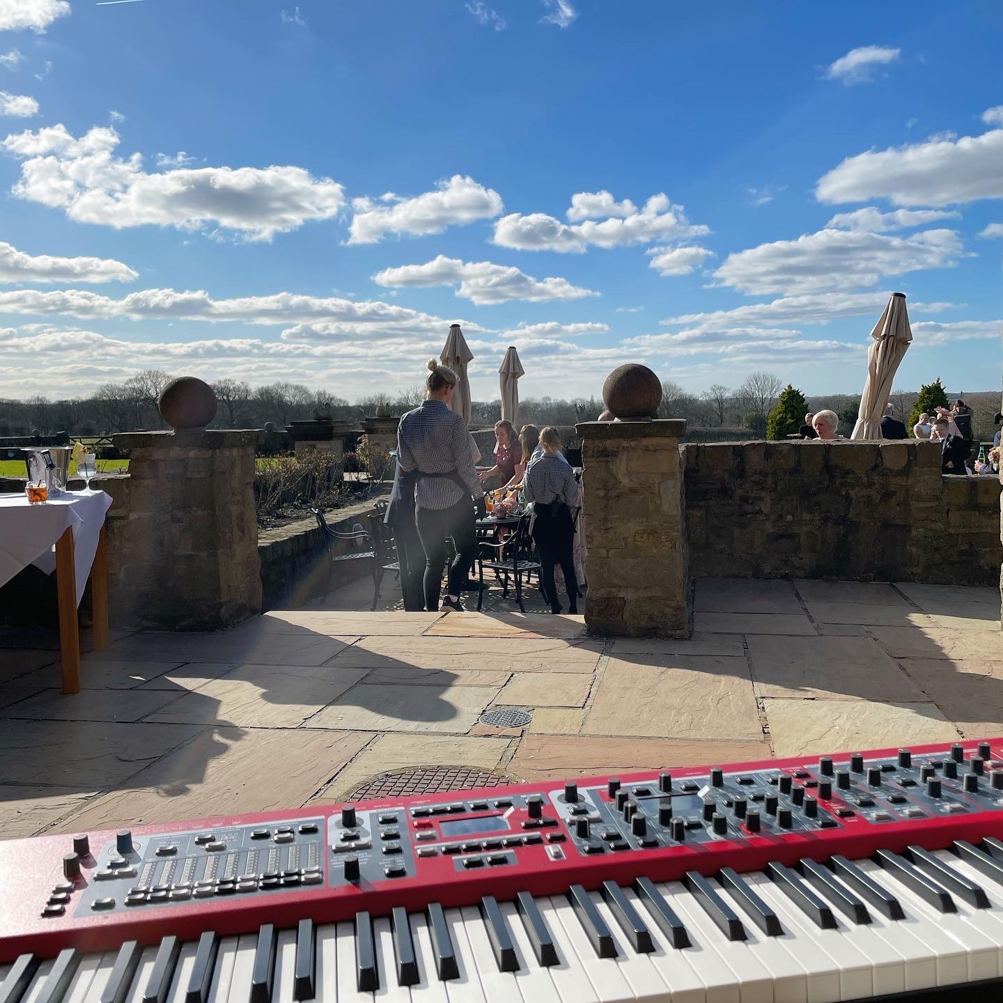 Live music with a view on the Beeston Manor terrace by wedding pianist Craig Smith