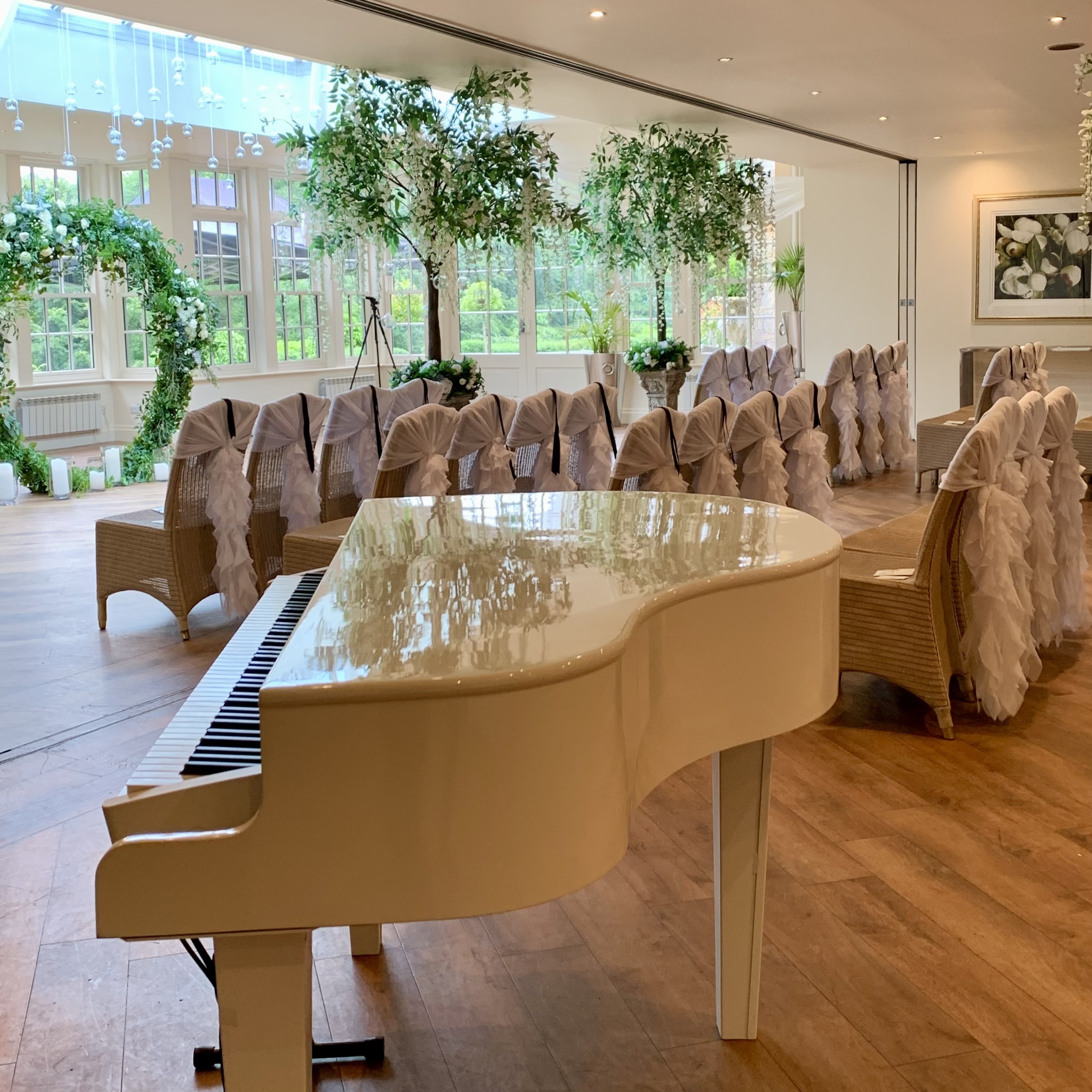 Mitton Hall wedding pianist Craig Smith's white piano ahead of a wedding ceremony