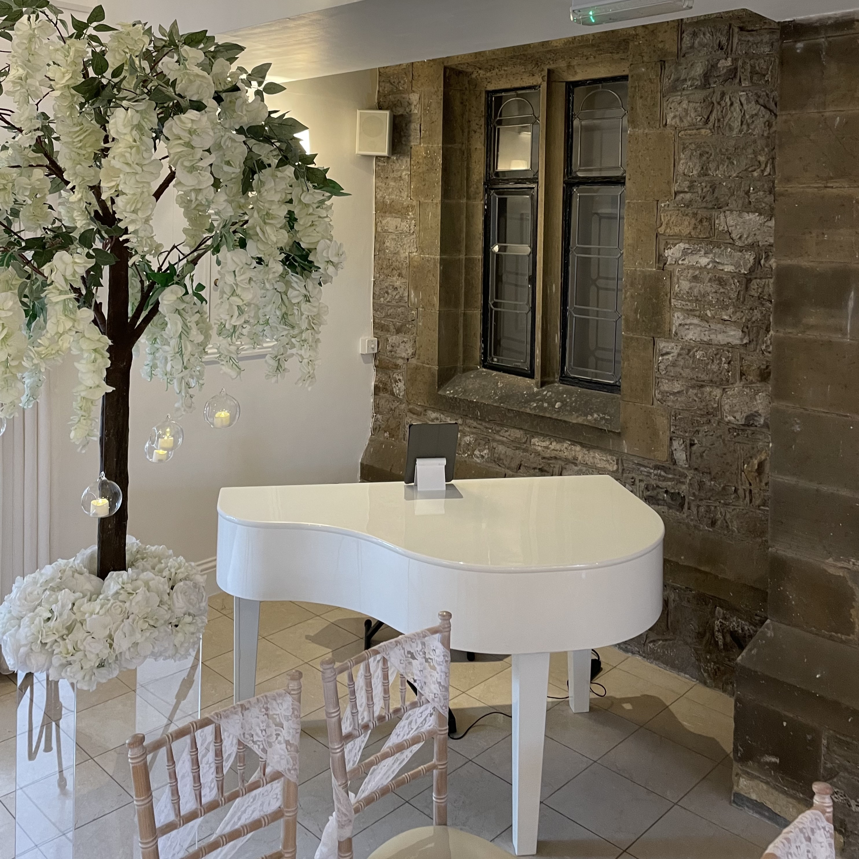 Stirk House wedding pianist Craig Smith's white piano set up for a Gallery wedding ceremony