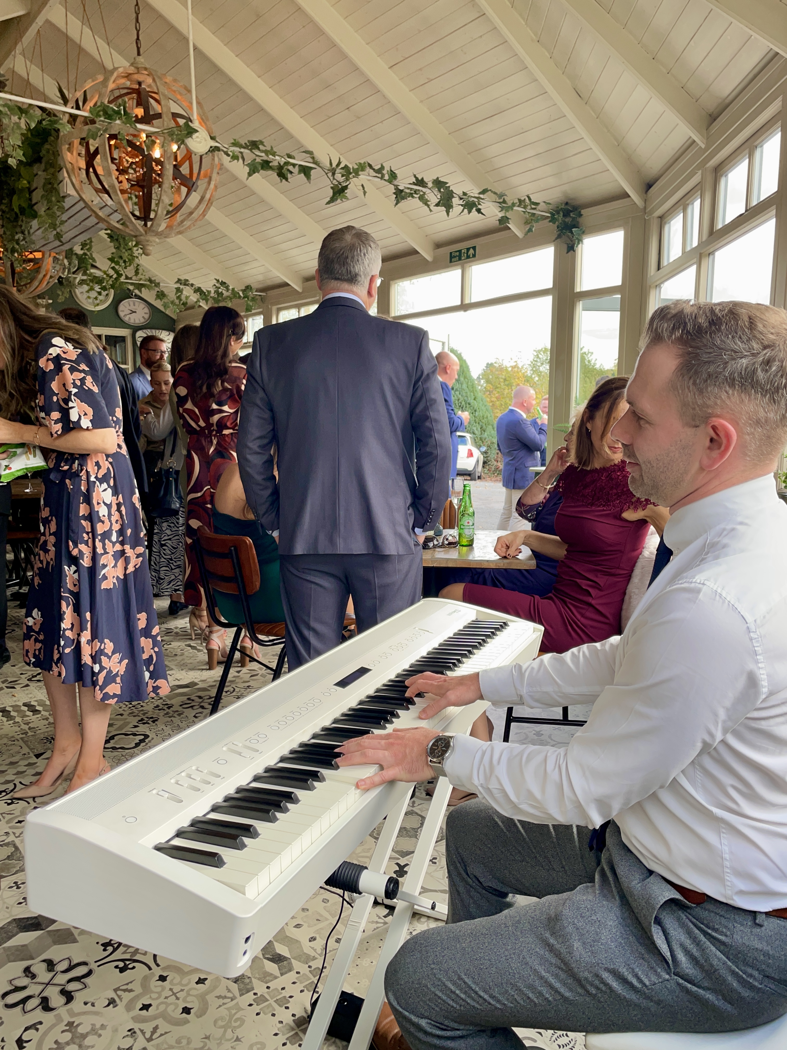 Live wedding piano during a Vicarage drinks reception by Craig Smith